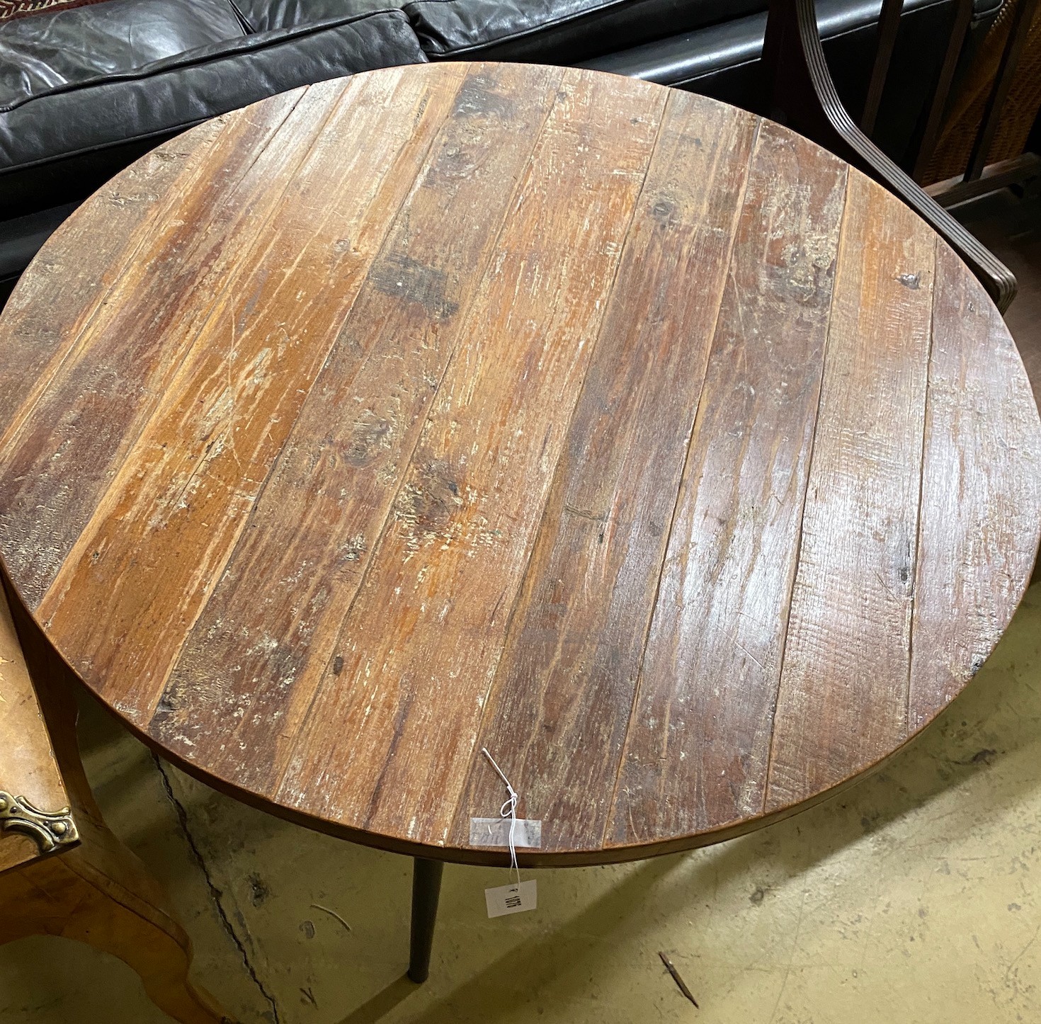 A teak top circular table with metal underframe, diameter 91cm, height 74cm